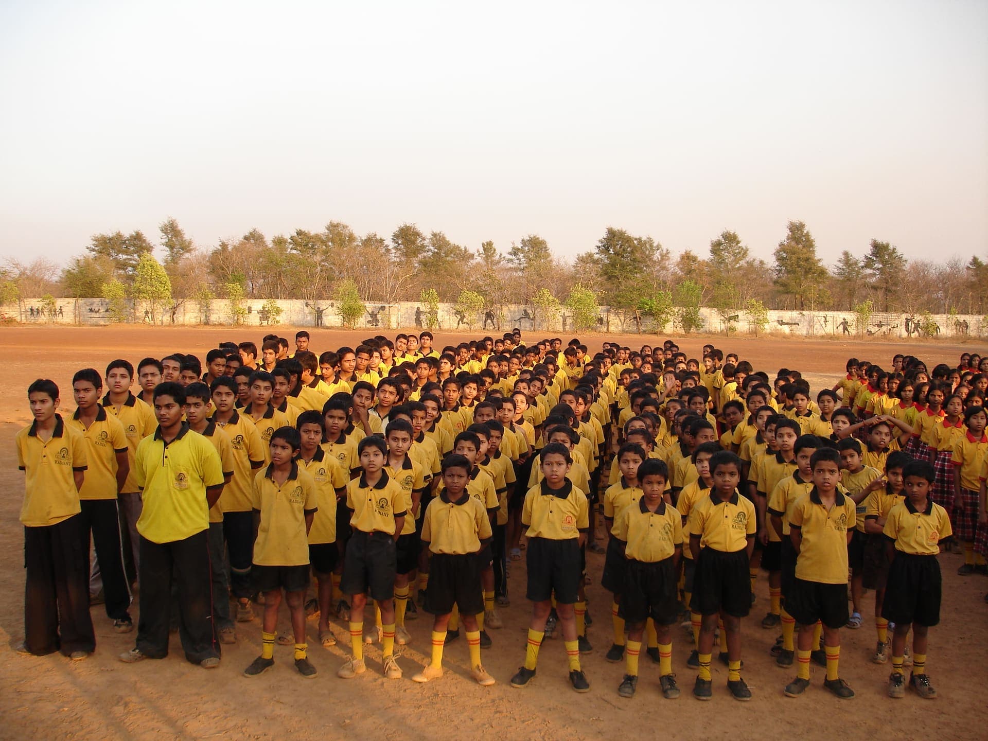 The whole school assembled on the front ground in sports uniform