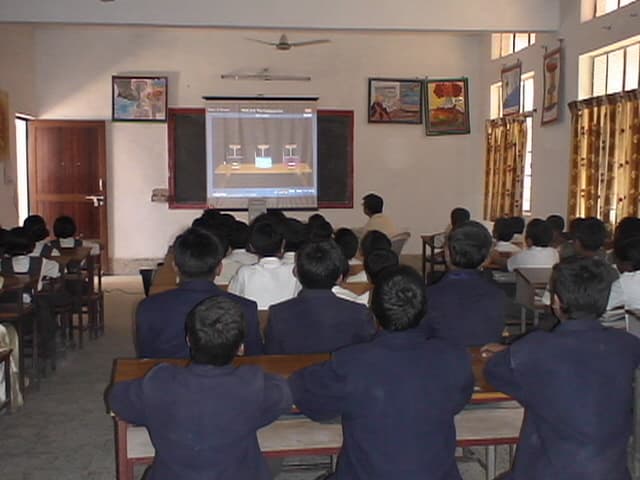 Boys watching a smart-classroom presentation