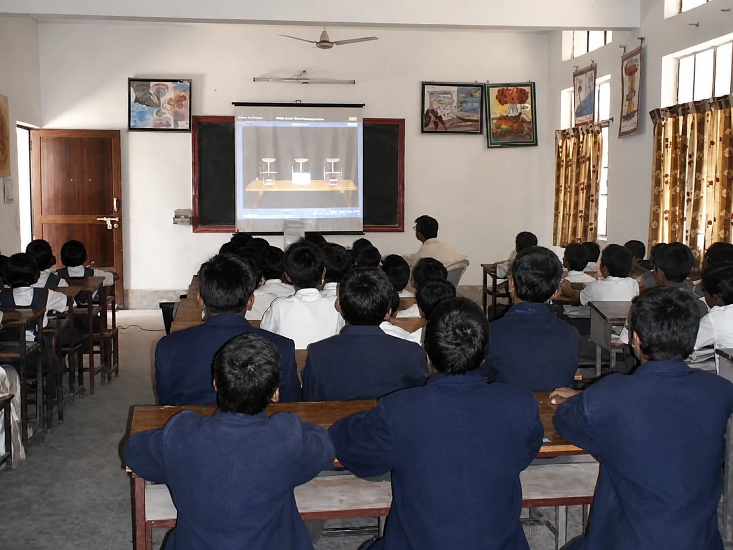 Boys watching a smart-classroom presentation
