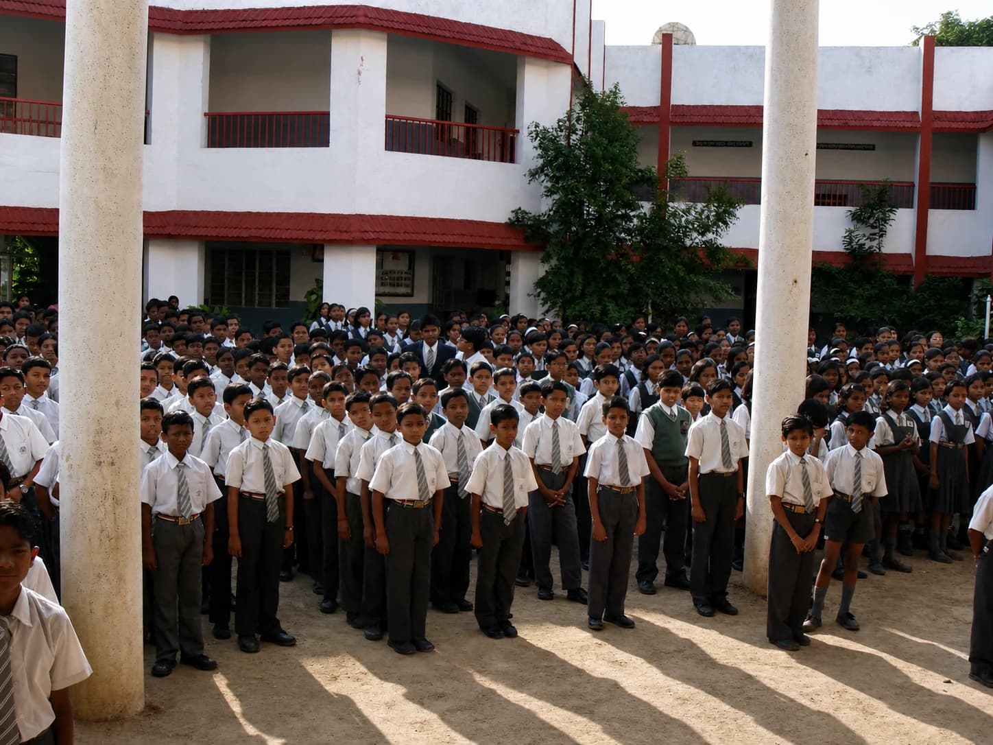 Students attending a formal school assembly